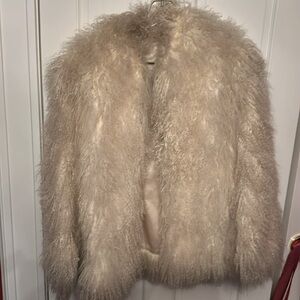 Long haired lamb jacket.  Vintage , needs a good cleaning